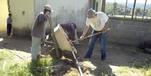 Renton Rotarian Norm Abrahamson handles some of the construction duties in January on a new multi-purpose building and church that is being built by volunteers in Belize. Four Renton Rotarians made the trip
