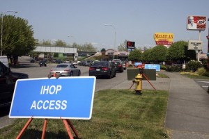 Prominent signs will identify driveways for businesses along Rainier Avenue during a two-year