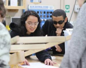 Jamie Costales leads members of the Lindbergh FIRST robotics team in a  discussion as they prepare for this year's competition.