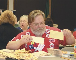 SPEEA member Dennis Davaz separates ballots Tuesday at SPEEA headquarters in Tukwila.