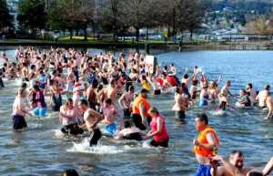 Dozens of 'polar bears' braved the cold waters of Lake Washington New Year's Day Sunday for the annual Polar Bear Dip at Gene Coulon Memorial Beach Park.