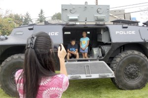 Linda Hee takes a picture of her children