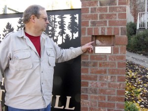 Dan Hemenway points to the space once occupied by the missing coal.