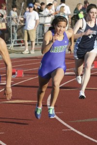 Liberty senior Kelsey Werre rounds the corner at the SeaKing 3A district meet last weekend. Werre qualified for state in four events