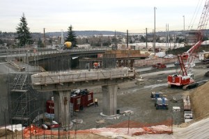 The state Department of Transportation and its private contractors are currently building the piers that will support the new Benson Road bridge over Interstate 405 near City Hall.