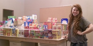 Ashley Dobson stands with donations she collected for the USO and soldiers and their families displaced by the earthquake and tsunami in Japan in early March.