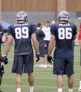 Tight ends John Carlson and Zach Miller listen to a play call at practice.