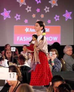 A young girl models the outfit of “Josefina