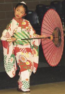 Kira Kusumi performs a Japanese dance at the first annual “World of Kennydale” Potluck at Kennydale Elementary School last month. Kira is a fourth grader at Kennydale.  More than 340 people attended the multicultural celebration