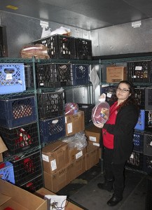 Martha Barrett with the Renton Corps of the Salvation Army counted just nine turkeys Tuesday morning in one of the big freezers at its food bank near Renton Municipal Airport. BELOW: The ingredients needed for Thanksgiving side dishes also fill just a small corner of a shelf at the food bank Tuesday morning.