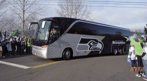 Fans cheer the Seahawks as they leave for last year's Super Bowl. This year's send-off celebration is Sunday morning in SeaTac.