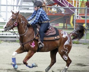 4-H member Shauna Fahley of Kent competes in a gaming event at the King County Fair on her horse “Cash.”