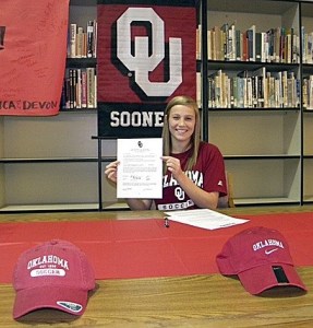 Liberty's Cassidy Nangle holds up her Letter of Intent to play soccer for the University of Oklahoma.