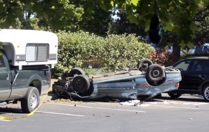 Three occupants were injured Friday morning when this Pontiac Grand Am