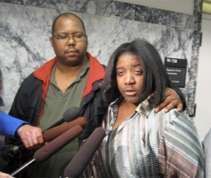 Louis and Ayanna Brown of Skyway speak with reporters Thursday afternoon outside a King County Superior Court courtroom just moments after Curtis Walker of Kent was convicted of killing their 12-year-old son Alajawan in April 2010.