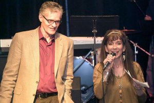 David and Lisa Mitts on stage at a fundraiser for Destiny House.