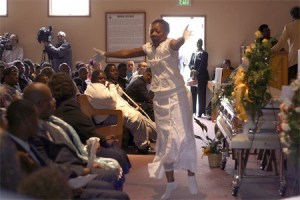 Fuhyda Rogers performs a praise dance at the Celebration of Life Monday to remember Alajawan Brown