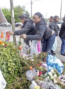 A prayer vigil Wednesday evening at the 7-Eleven store on Martin Luther King Jr. Way where 12-year-old Alajawan Brown died of a gunshot wound drew more than 100 mourners. Placing his favorite snacks – Starbursts and Cheetos – on the memorial