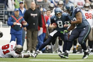 Guard Rob Sims blocks in front of quarterback Matt Hasselbeck.