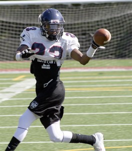 Lindbergh senior Diondre Toms reaches for a pass at practice.