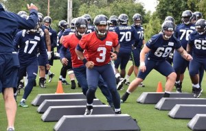 Quarterback Russell Wilson runs through drills during minicamp June 14.