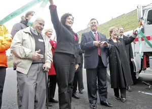 Cutting the ceremonial ribbon for the new I-405 onramp at Talbot Road is from left