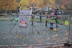 A fence circles one of the playground areas at Petrovitsky Park in Fairwood.