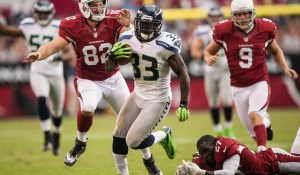 Leon Washington returns a punt against the Cardinals.