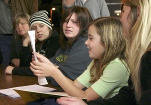Eight-year-old Haley DePriest from Fairwood Elementary reads a letter to a district representative