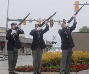 Members of the honor guard fire during the 21-gun salute during Monday's memorial Day Celebration at the Veterans Memorial in downtown Renton.