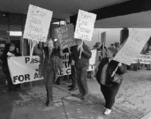 Carrying signs in support of public animal shelters are from the left: Vicki Hurley