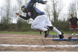 Sophomore Frank Cange leaves the blocks in practice at Lindbergh High School. Cange competes in the 100- and 200-meter races