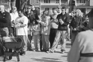 A group of volunteers gathered for a City of Renton Earth Day event at Heritage Park listens to city staff speak before planting trees