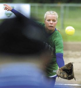 Liberty High School pitcher Jesi Siemons dives for a short pop up back to the mound but doesn’t quite make it and the Enumclaw runner is safe at first base in state softball tournament play Friday morning in Tacoma.