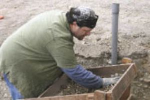 Archaeologist Jason Cooper sifts through rock and dirt in early May