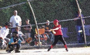 Matt Kvech of the Renton Little League Minors Cardinals swings at a pitch during the District 7 Tournament of Champions. The Cardinals won the tournament.