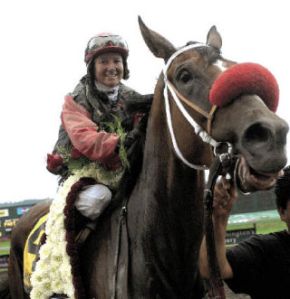 Jockey Jennifer Whitaker aboard Wasserman after winning the Longacres Mile.