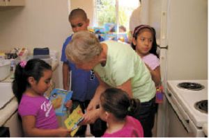 Maxine Matthew instructs students in the kitchen of a an apartment at Maplewood Park Apartments. Matthew