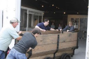 It took four people to push the refurbished coal car into Renton History Museum last week. The car spent seven months undergoing reconstruction at the Northwest Railway Museum in Snoqualmie. Pictured