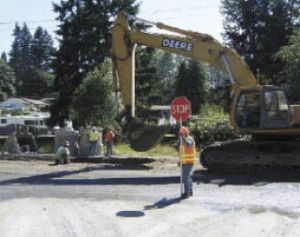 Crews work on a utility vault recently on Duvall Avenue.