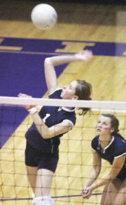 Linbergh’s Kristin Huffman hits the ball as teammate Erin White backs her up with defense against a block against Highline.