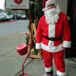 Ed Sykes poses next to his bucket outside a Renton grocery store. He has been volunteering for the past five years. (Above: Courtesy photo. Below: Leah Abraham | Renton Reporter)