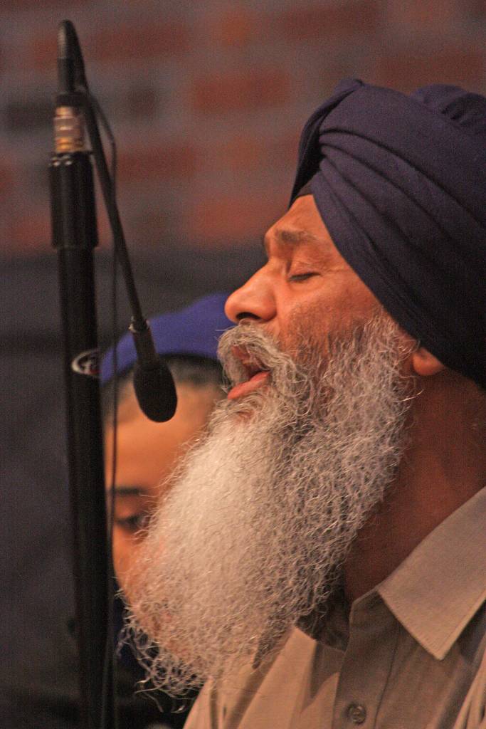 Bhai Mann Singh performs a ceremonial song during the community rally at Kent Lutheran Church on Saturday. MARK KLAAS, Kent Reporter