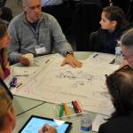 A group works on its sketch during the Kent School District&rsquo;s Tech Summit on March 18. The sketches will be used to make a video showing how technology should be used in the district. HEIDI SANDERS, Kent Reporter