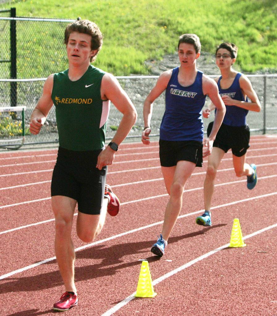 Freshmen Aiden Holmes (in front) and Alex Chin run the 1600 meters during Thursday&rsquo;s meet. Chin came in fourth followed by Holmes in fifth place.