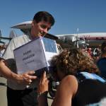 Ted Weinberg, left, helps a woman view the eclipse through a projector he made. HEIDI SANDERS, Reporter