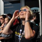 A woman looks in awe at the eclipse. HEIDI SANDERS, Reporter