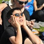 James Yunger, 13,of Bellevue views the eclipse through special glasses. HEIDI SANDERS, Reporter