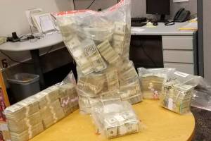 King County Sheriff&rsquo;s Office seize $3 million in cash, above, 6,000 marijuana plants and 180 pounds of processed marijuana from a Newcastle home. (Courtesy photo)