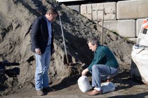 Flood Control District Supervisors Reagan Dunn, left, and Dave Upthegrove, right, filling up a sandbag at the Sandbag Distribution Location in the Renton on Friday. (Courtesy photo)